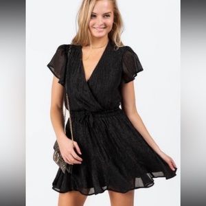 Francesca’s black sparkly dress